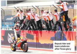  ??  ?? Repsol rider and team celebrate after Texas glory