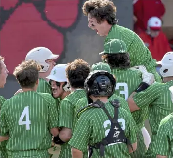  ?? Matt Freed/Post-Gazette ?? South Fayette’s Tristan Bedillion is mobbed by teammates after hitting a two-run home run against Moon this season. Teams are enjoying the back-to-back format this year.