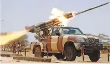  ?? AFP ?? Yemeni forces launch rockets against Al Houthi positions in Marib province in May 2015.