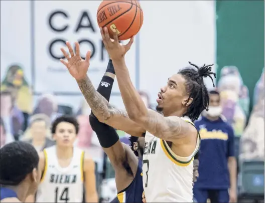  ?? James Franco / Special to the Times Union ?? Siena senior Manny Camper had 17 points and 11 rebounds on Senior Night, helping to lead the Saints past the stubborn Golden Griffins.