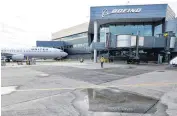  ??  ?? A Boeing 737-900ER airplane being delivered to United Airlines is parked in front of Boeing’s newly expanded 737 delivery center at Boeing Field in Seattle. Boeing landed some orders valued at $1.5 billion for its 747 jumbo jetliners.