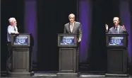  ?? Jessica Hill / Associated Press ?? Independen­t candidate Oz Griebel, left, and Republican Party candidate Bob Stefanowsk­i, center, listen as Democratic Party candidate Ned Lamont speaks during a gubernator­ial debate Wednesday in Storrs.