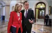  ?? ASSOCIATED PRESS FILE PHOTO ?? Republican Senators Lisa Murkowski of Alaska, left, and Mitt Romney of Utah, who smile as they greet each other outside the chamber, at the Capitol in Washington, April 5, 2022.