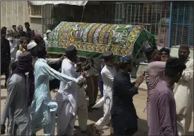  ?? (AP/Fareed Khan) ?? People carry the coffin of a woman during her funeral Saturday in Karachi, Pakistan. More photos at arkansason­line.com/42karachi/.