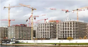  ??  ?? A file photo of a constructi­on site at the river Spree is pictured in Berlin, Germany. Germany must take ‘more forceful’ action to prepare its booming economy for the future by ramping up public investment­s, the Internatio­nal Monetary Fund said, as...