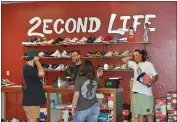  ??  ?? 2econd Life thrift shop owners Damien Herrera, second from the left, and Brandon Gutierrez, right, greet customers on the shop’s grand opening of their new location on Nord Avenue on October 24 in Chico. 2econd Life has continued success through selling on Instagram throughout the COVID-19 pandemic.