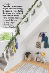  ??  ?? hall To make the entrance bright and welcoming, the couple remodelled the stairs, and painted everywhere white. Hand-knitted stockings, £45 each, Prinku. Try Bay Stripe Dhurrie rug, £20.99, Wayfair
