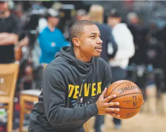  ?? David Zalubowski, The Associated Press ?? Guard Isaiah Thomas is providing help to the Nuggets even though he has not suited up for them yet. The veteran provides experience for a young team.