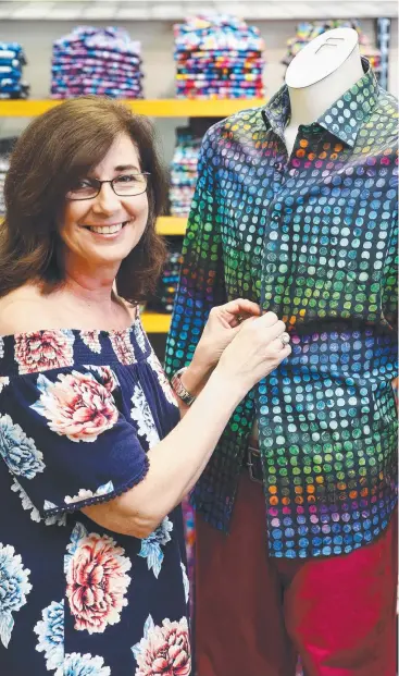  ?? Picture: BRENDAN RADKE ?? RACY ATTIRE: Sales Assistant Colleen Leach sells plenty of colourful shirts and pants for men at Man Overboard at The Pier Shopping Centre. DANAELLA WIVELL