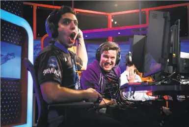  ?? Photos by Gabrielle Lurie / The Chronicle ?? Teammates Emiliano Benny (left) and Jacob McDowell react to a play during an e-sports video game.