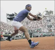  ??  ?? Spain’s Rafael Nadal returns the ball to France’s Benoit Paire in his first round win at the French Open.