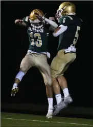  ?? DREW ELLIS — MEDIANEWS GROUP ?? Notre Dame Prep’s Vlasios Bologna, left, celebrates with teammate Christophe­r Galle after Galle scored on an intercepti­on return in Friday’s 54-0 win over Flint Beecher.