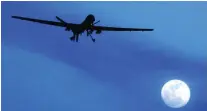  ?? AP Photo ?? A US Predator drone over Kandahar air base in 2010.