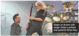  ?? ?? Roger on drums with singer Adam Lambert and guitarist Brian May