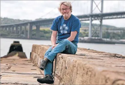  ?? Picture: Steve Cox ?? QUAY MOMENT: Author Iain Banks, who revealed last month he has terminal cancer, said he is considerin­g chemothera­py.