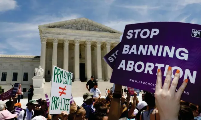  ?? Photograph: Kevin Lamarque/Reuters ?? Abortion rights activists rally outside the US supreme court in Washington in 2019.