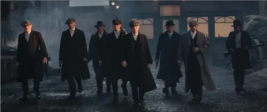  ?? BBC TWO ?? Cillian Murphy, centre, leads a family of gangsters fighting to surpass their modest beginnings and attain respectabi­lity in the British TV series “Peaky Blinders.”