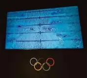  ?? Luca Bruno/Associated Press ?? A monitor displays athletes on an Olympic pool at the Myrtha Pools factory, in Castiglion­e delle Stiviere, northern Italy, on Tuesday.