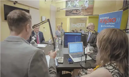  ?? STAFF PHOTO BY MARK GARFINKEL ?? PARTY FOES: Joe Battenfeld and Hillary Chabot, backs to the camera, of the Boston Herald talk to candidates for U.S. Senate, from left, Geoff Diehl, Beth Lindstrom and John Kingston yesterday.