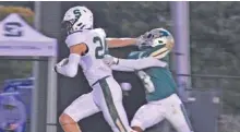  ?? STAFF PHOTO BY PATRICK MACCOON ?? Silverdale Baptist’s Caiden Botts stiff-arms a Notre Dame defender on his touchdown reception Thursday night.