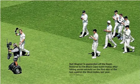  ?? GETTY IMAGES ?? Neil Wagner is applauded off the Basin Reserve by his Black Caps team-mates after taking seven wickets on the first day of the test against the West Indies last year.