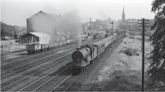  ?? A Linaker/Kiddermins­ter Railway Museum ?? GCR ‘D11/1’ 4-4-0 No 62666 Zeebrugge has run down light engine from Staveley shed and now departs from Chesterfie­ld (Central) with the fivecoach 4.30pm to Sheffield (Victoria) on Tuesday, 6 July 1959. Once the London express work was curtailed at the beginning of 1960, the remaining weekday passenger service comprised five through trains (which were not advertised as through workings) each way, mainly between Nottingham (Victoria) and Sheffield (Victoria), two short workings each way between Chesterfie­ld (Central) and Sheffield (Victoria), and the 1pm from Leicester (Central) which terminated here at 2.58pm and presumably provided the stock for the pictured train. There were, however, additional seasonal workings, including inter-regionals and a train to Blackpool. Of note are the huge goods shed and its up side yard (closed to public goods from 11 September 1967), and the height of the semaphore signal on the right – a footbridge was a good photograph­ic vantage point but interfered with ‘sighting’. Ultimately, the loss of the railway here provided a course for the A61 main road.