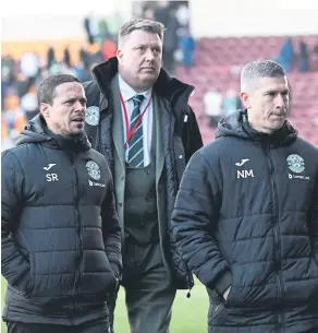  ?? ?? Hibs manager Nick Montgomery and his assistant Sergio Raimundo leave the pitch