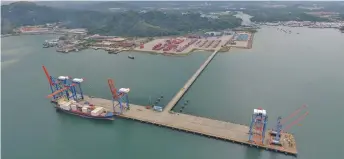  ??  ?? Photo shows a Sapangar Bay Container Port in Sabah. Analysts are positively surprised when WCT-CCCC in a 60:40 JV recently secured a RM899.8 million contract from the Malaysian government to undertake the expansion of Sapangar Bay Container Port in Sabah.