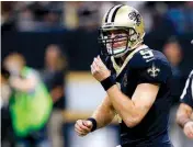  ?? Associated Press ?? New Orleans Saints quarterbac­k Drew Brees reacts after completing a pass Saturday during the first half against the Atlanta Falcons in New Orleans. Brees surpassed 70,000 career passing yards on the play.