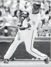  ??  ?? San Francisco’s Barry Bonds is about to connect on a two-run homer to pass Babe Ruth for the 715th homer of his major-league career, 12 years ago today.