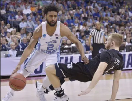  ?? BRANDON DILL — ASSOCIATED PRESS ?? North Carolina’s Joel Berry II drives past Butler’s Tyler Lewis during Tar Heels’ victory in South Regional semifinal.