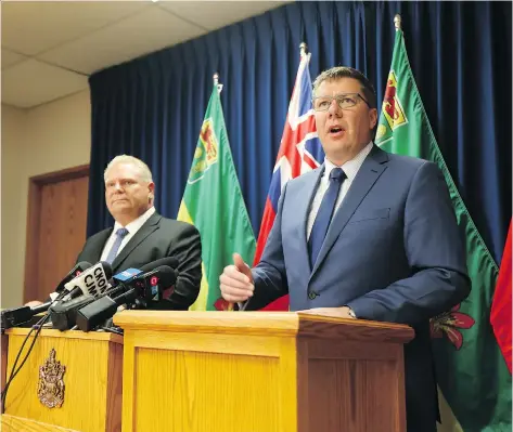  ?? MATT OLSON ?? Ontario Premier Doug Ford and Saskatchew­an Premier Scott Moe present a united front against Ottawa’s carbon pricing plan in Saskatoon on Thursday. The premiers also announced Saskatchew­an’s decision to file for intervener status in Ontario’s constituti­onal reference case.