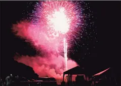  ?? Contribute­d photo ?? Rockets burst over Long Island Sound off West Haven’s Bradley Point at the West Haven Centennial Celebratio­n fireworks on Friday.