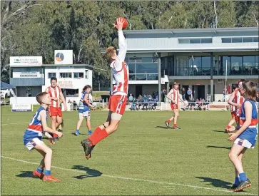  ?? Photos by Helen Barker. ?? Toc Under-14 player Liam Sutton in his best on ground performanc­e, was able to intercept the ball on many occasions to assist his side cement their place in the Grand Final.