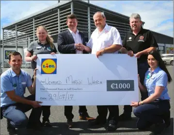  ??  ?? The cheque is presented outside Lidl’s Wexford store (from left): Edgars Spole, Store Manager; Madeline White, Customer Assistant; Damien McClean, SOM Lidl; Frank Flanagan, Wexford Marine Watch; Rob Denby, Wexford Marine Watch; and Nicola Jordan,...