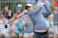  ?? — REUTERS ?? Rory Mcilroy of Northern Ireland hits a tee shot on the first hole during the third round of the Valero Texas Open.