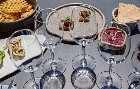  ?? Juliana Yamada/Special to The Chronicle ?? Food pairings at Robert Mondavi Winery’s new temporary tasting room Arch and Tower in downtown Napa.