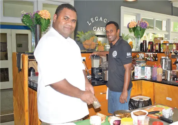  ??  ?? Apetia Tui (left) and Mikaele Gukibau of Legacy Cafe and Health Bar at Pacific Harbour, prepare orders for home delivery on April 16, 2020.