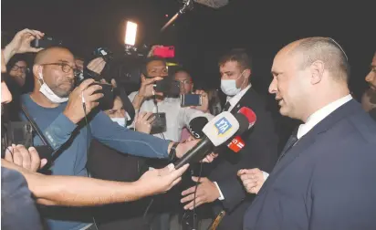  ?? (Avi Ohayon/GPO) ?? PRIME MINISTER Naftali Bennett addresses the press before departing the US yesterday.