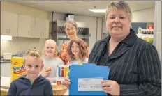  ?? LAWRENCE POWELL ?? Betty Lajoie, back, dropped off a generous $1,000 from the Soldiers Memorial Health Auxiliary to help top up the Annapolis East Elementary School’s Student Care Fund. Principal Nancy Ilsley was there to accept the money that, in part, will help with the school’s breakfast program.