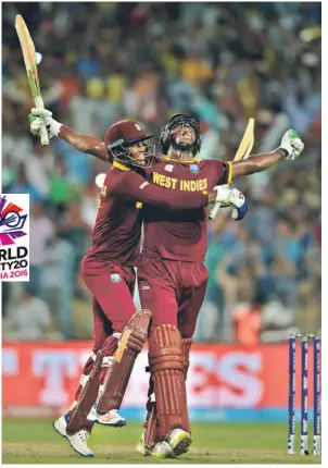  ?? K. R. DEEPAK ?? Double delight: West Indies batsmen Marlon Samuels and Carlos Brathwaite celebrate their team's victory over England in the ICC World Twenty20 final at the Eden Gardens in Kolkata.