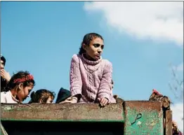  ?? AREF TAMMAWI/EPA ?? Displaced residents from areas under Kurdish control arrive Tuesday in a village in the Afrin district of northern Syria. Turkish troops have surrounded the rebel town of Afrin.