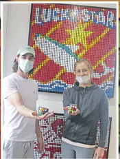  ?? ?? Logan Woolfson and Elmari de Wet are pictured with one of Woolfson’s extraordin­ary pieces made from Rubik’s Cubes. Photo: Estelle Sinkins
