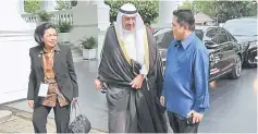  ??  ?? This handout photo from the Asian Games 2018 Executing Committee (INASGOC) shows Olympic Council of Asia President Sheikh Ahmad Al-Fahad Al-Sabah (centre) and Chairman of INASGOC Erick Thohir (right) and Rita Subowo walking in the presidenti­al palace...