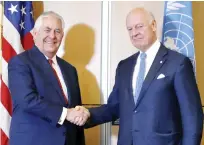  ??  ?? US Secretary of State Rex Tillerson, left, shakes hands with UN Special Envoy for Syria Staffan de Mistura before their meeting in Geneva on Thursday. (AFP)