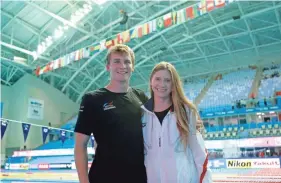  ??  ?? High divers Ellie Smart and Owen Weymouth travel the world competing together and coaching each other to new extremes. LEE JIN-MAN/AP