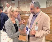  ?? David Crowder ?? Georgia DBHDD Commission­er Judy Fitzgerald (left) speaks with Dr. Nizam-uddin Khaja of Highland Rivers Health’s Polk Recovery and Wellness Center in Cedartown at the NAMI Rome service.