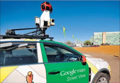  ?? Pedro Ladeira AFP/Getty Images ?? GOOGLE emerged as the winner in consumer digital maps by blanketing the globe with street-mapping cars. Above, one in Brazil in 2011.