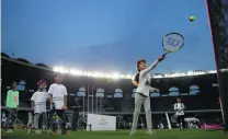  ?? Ravindrana­th K / The National ?? Children practice tennis on the National Sports Day at Zayed Sports City in Abu Dhabi.