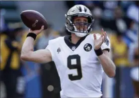  ?? JAE C. HONG — ASSOCIATED PRESS ?? Saints quarterbac­k Drew Brees throwing a pass during the first half of an preseason game against the Chargers in Carson, Calif., last Saturday.